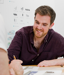 Man drawing a technical drawing.